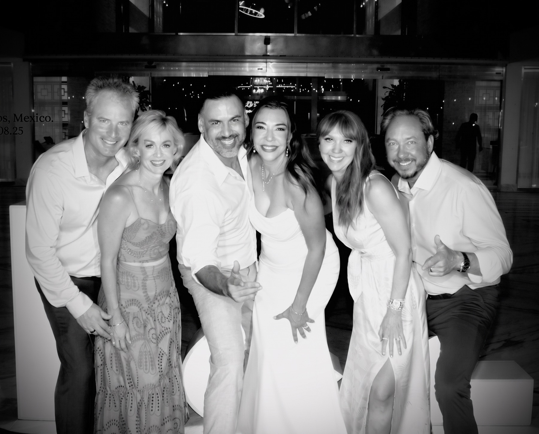 Friends dressed in white in the Le Blanc lobby