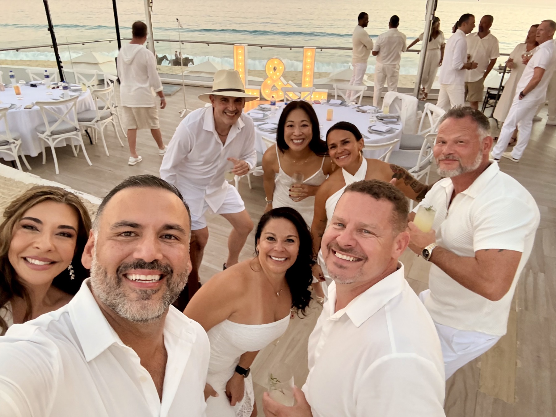 Beach-deck selfie with the marquee letters behind