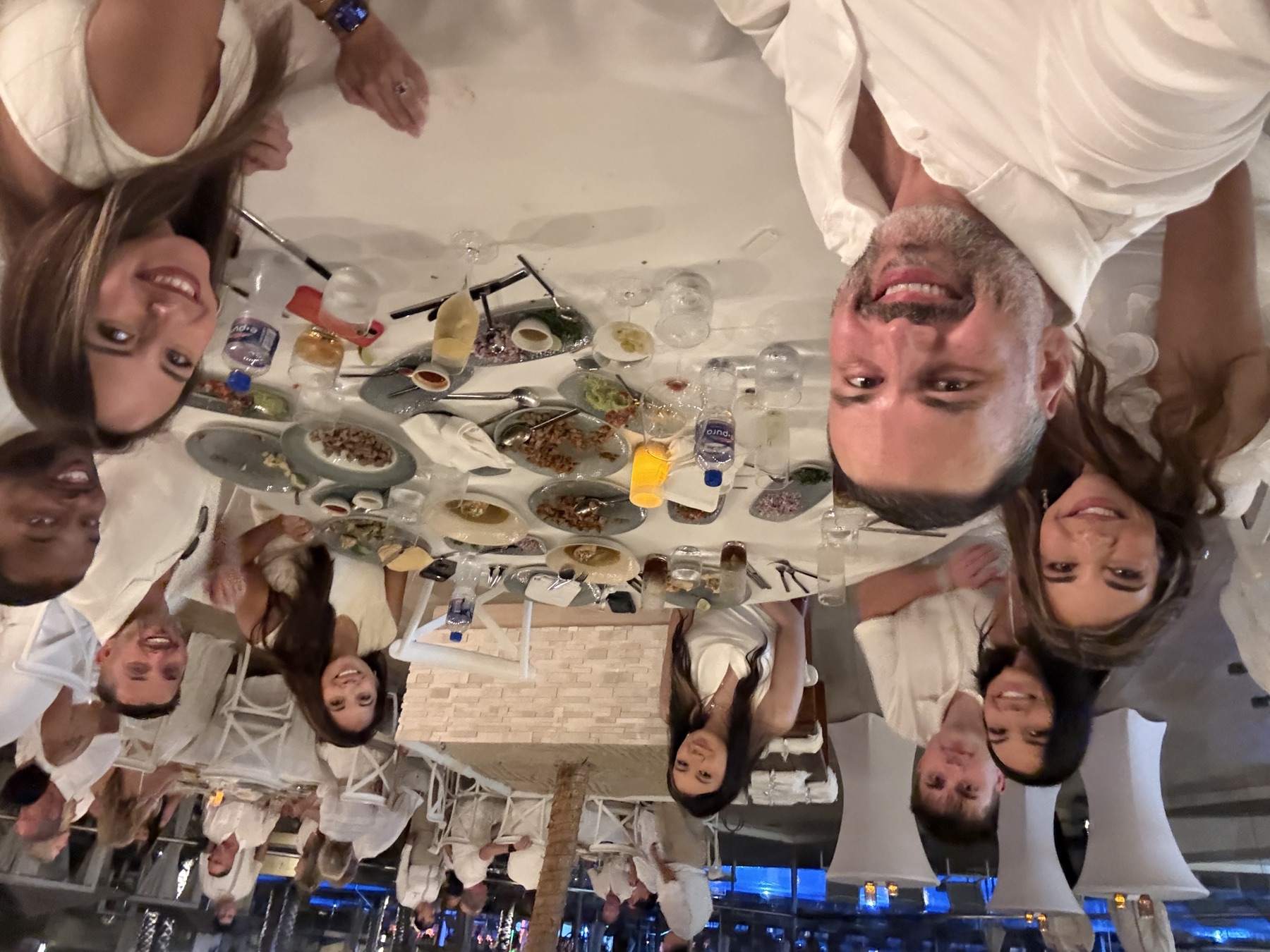 Table selfie with the crew at dinner in white