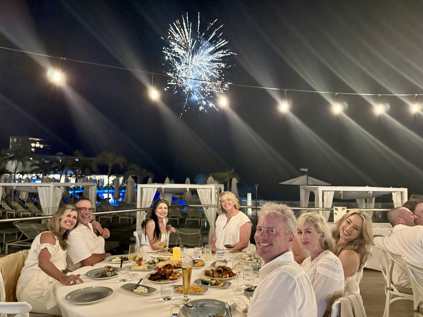 Fireworks bursting over dinner on the deck