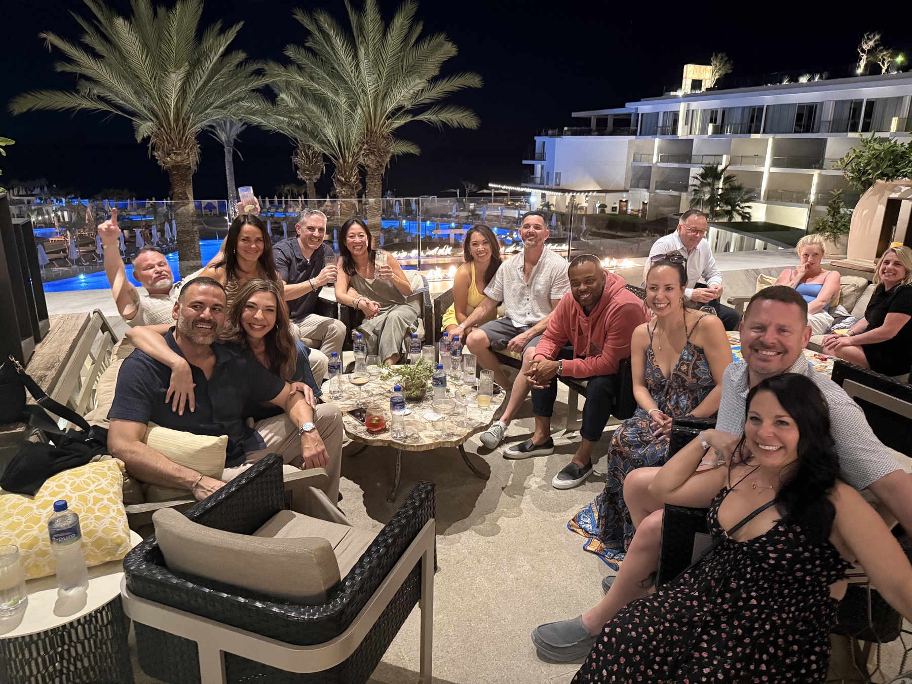 The crew winding down on the patio at night