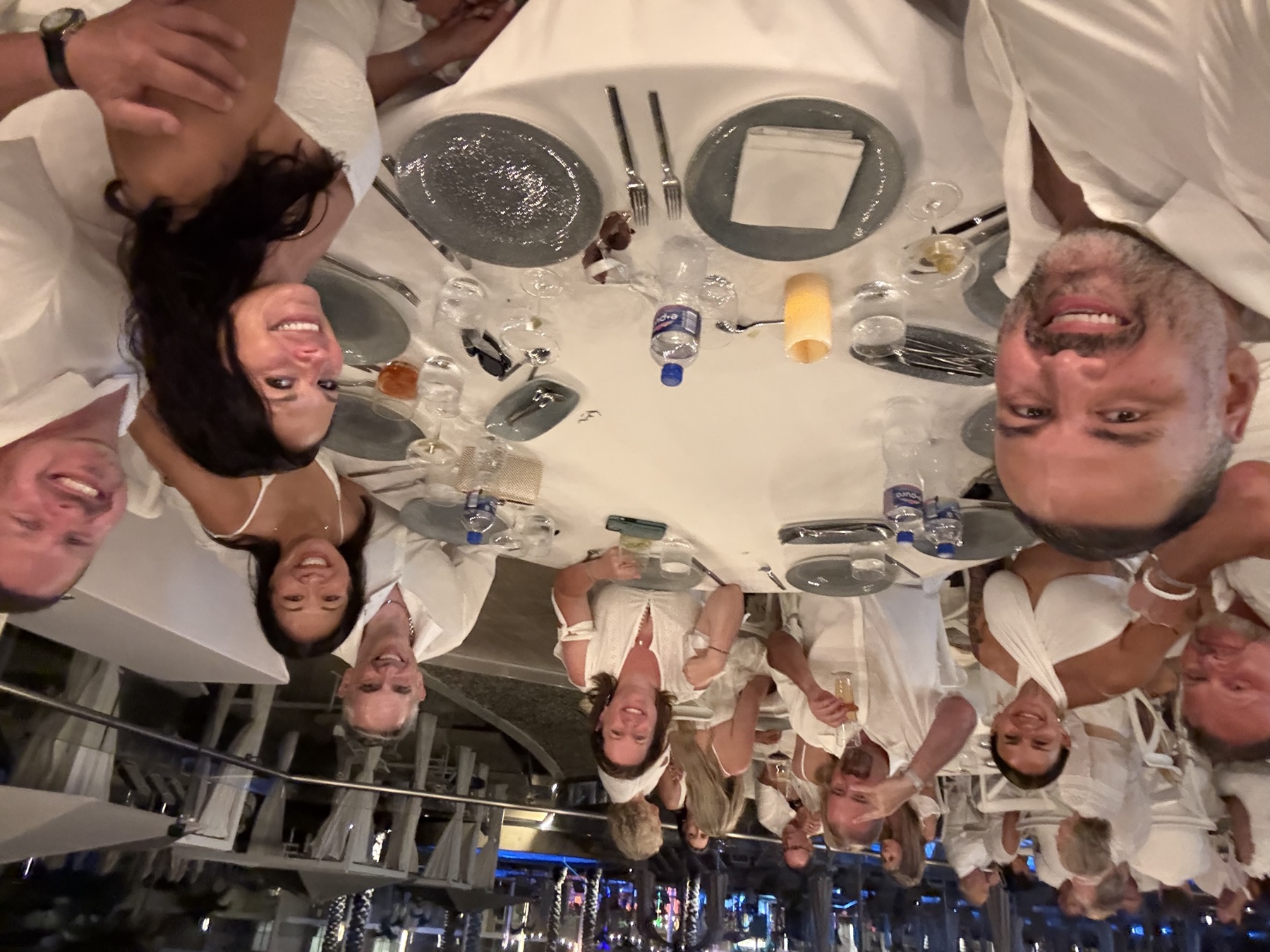 Round-table selfie at the white party dinner